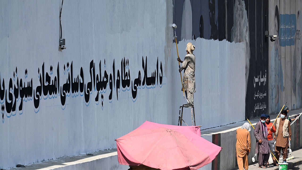 Photo of Taliban painting over western murals in Kabul, including George Floyd mural