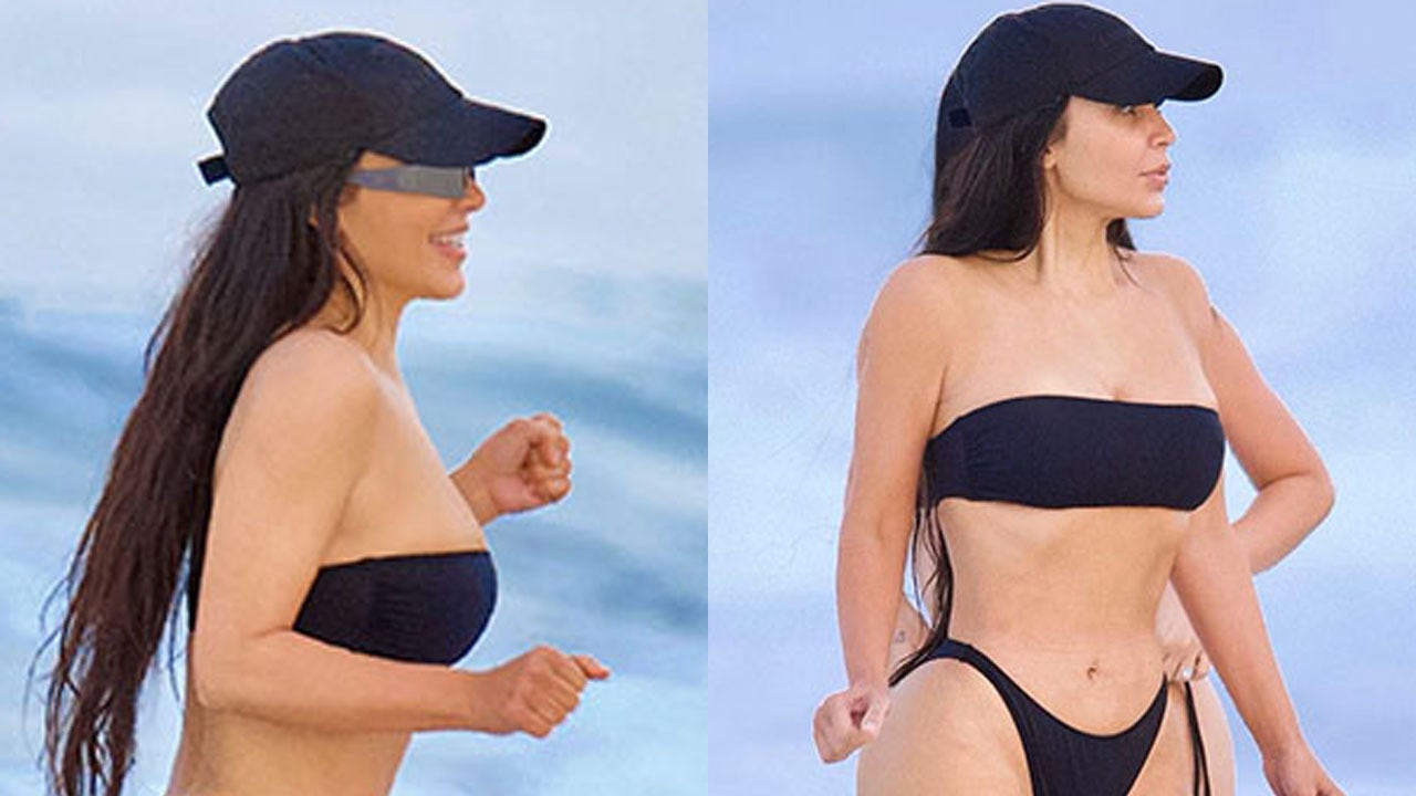 Kim Kardashian flaunts figure in cheeky black bikini during beach outing