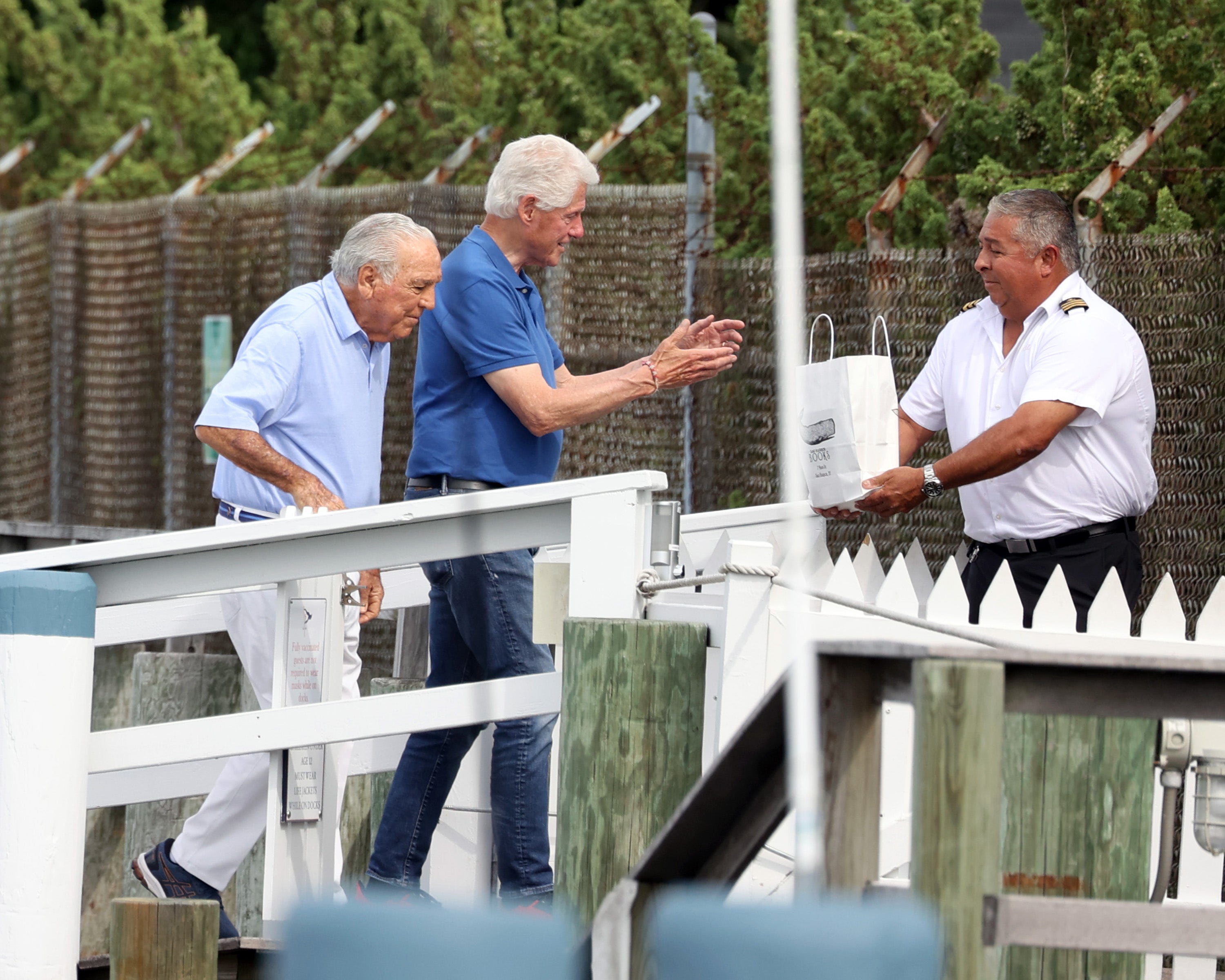 Bill Clinton spotted in Hamptons boarding yacht with Epstein-connected billionaire sugar baron brothers