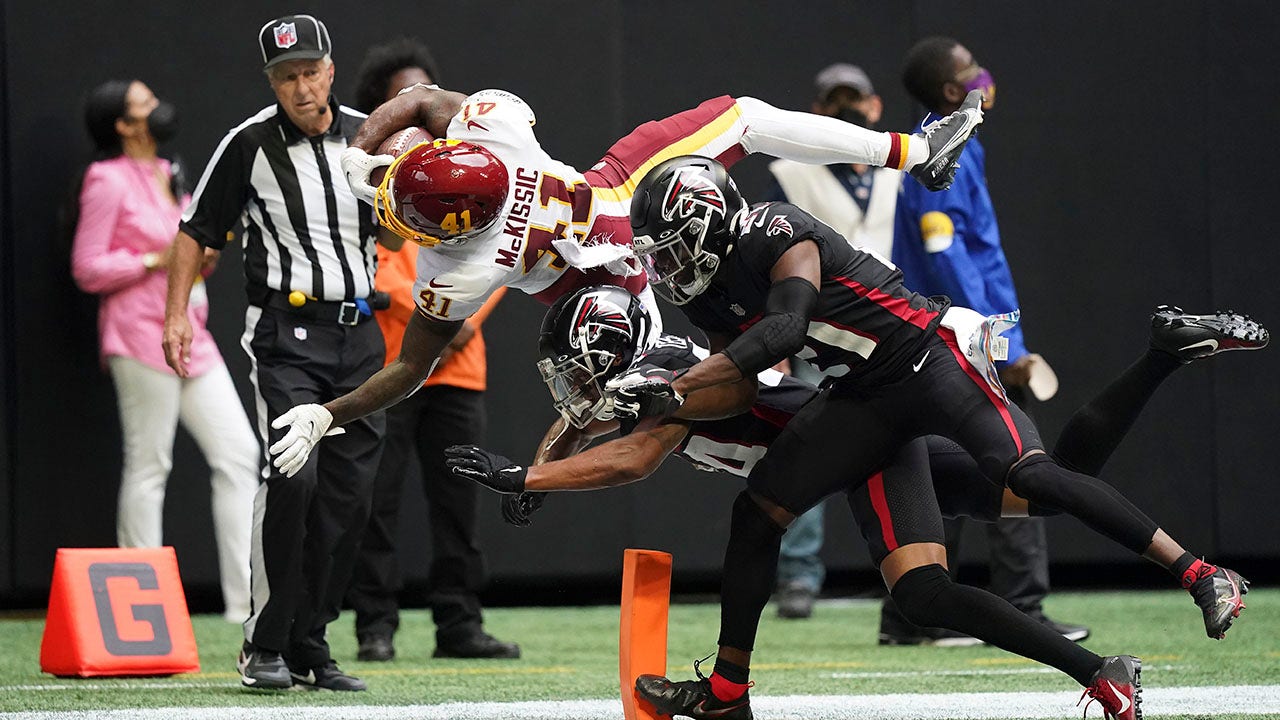 J.D. McKissic of the Washington Football Team dives for a