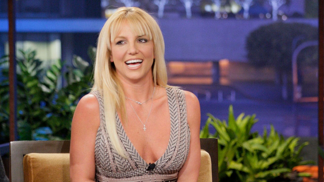 Britney Spears slams 'consultations for body improvements' in topless photo post: 'Rather fall off a cliff'