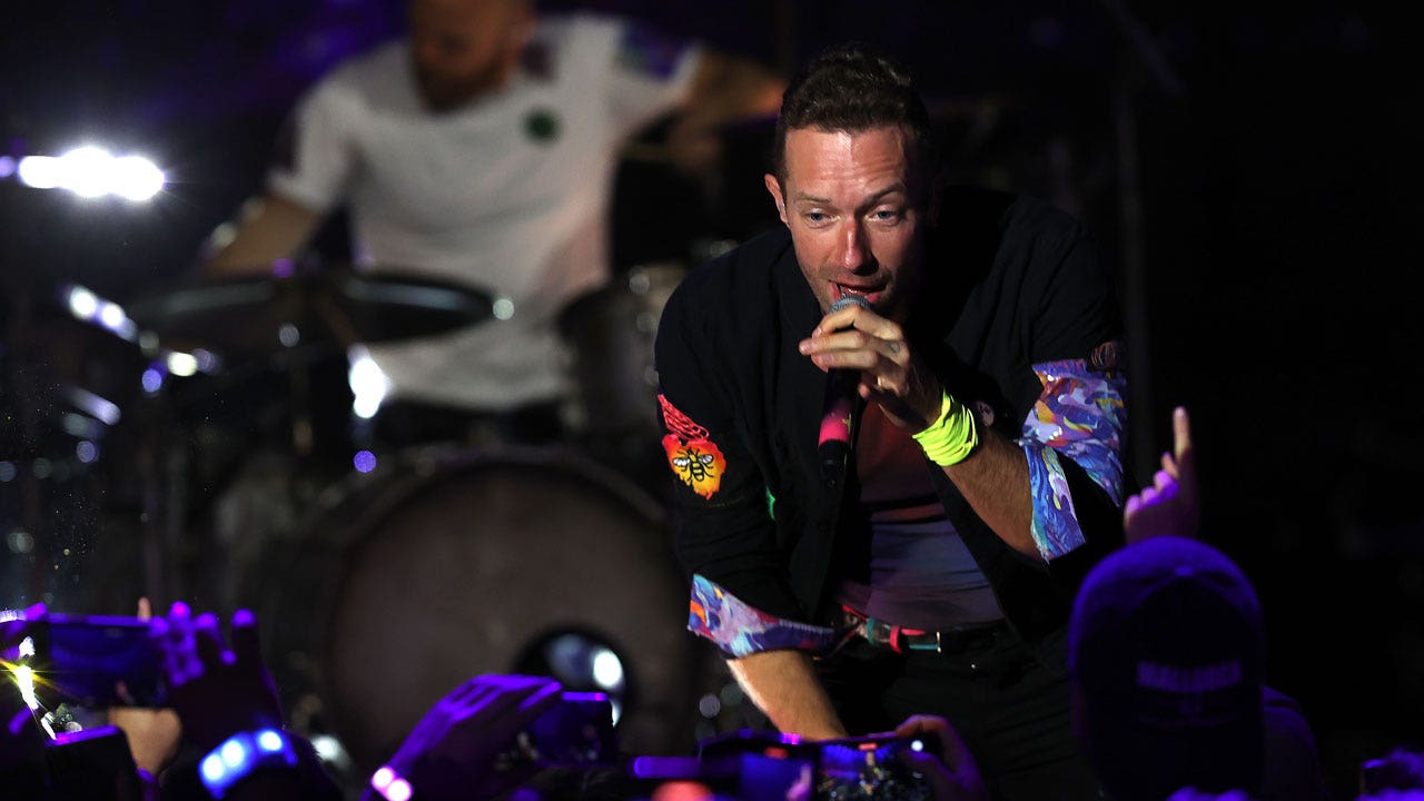 Chris Martin honors girlfriend Dakota Johnson during Coldplay concert: 'This is about my universe'
