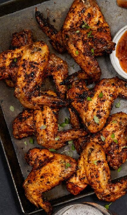 Jamaican jerk chicken wings with mango rum dip for game day
