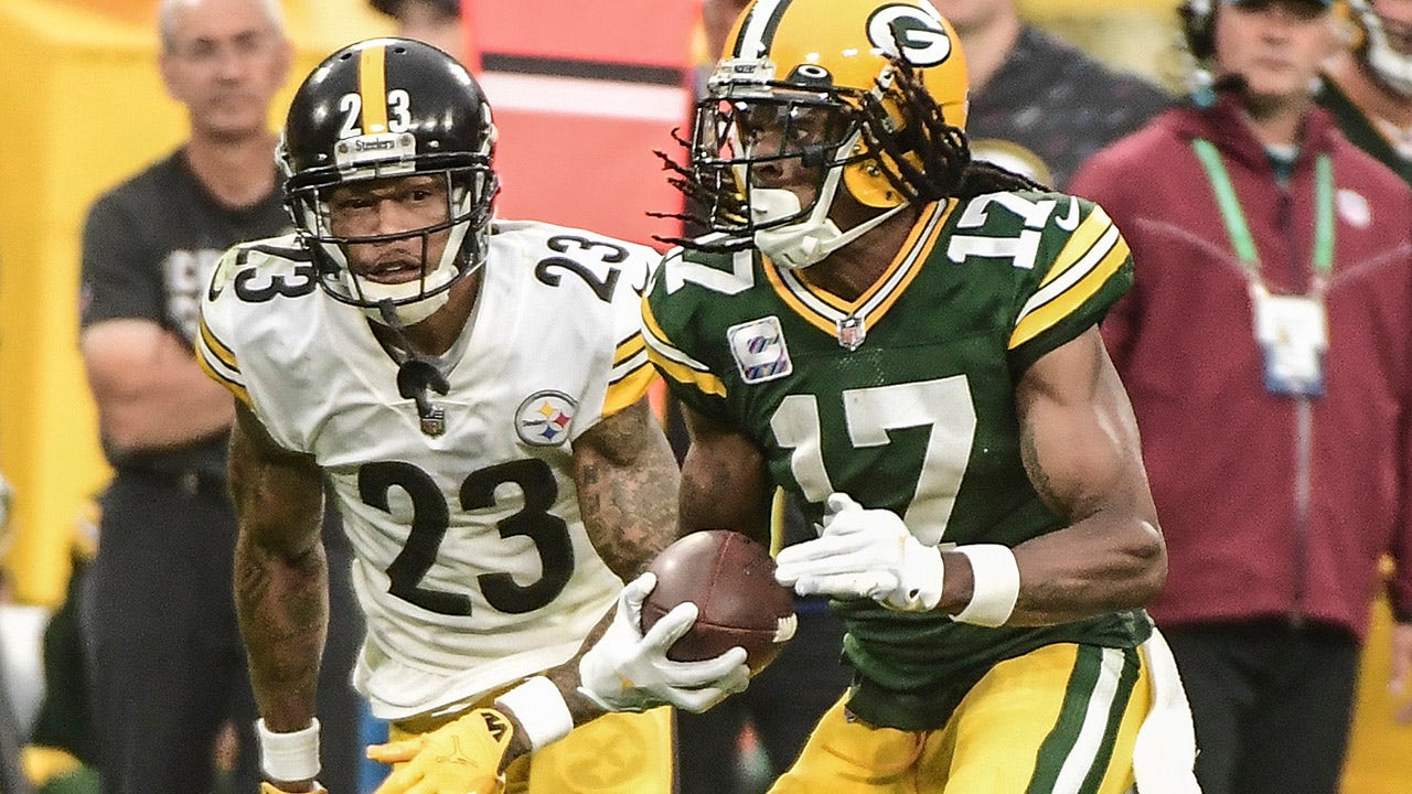 Green Bay Packers' Randall Cobb catches a touchdown pass in front of  Pittsburgh Steelers' Minkah Fitzpatrick during the second half of an NFL  football game Sunday, Oct. 3, 2021, in Green Bay