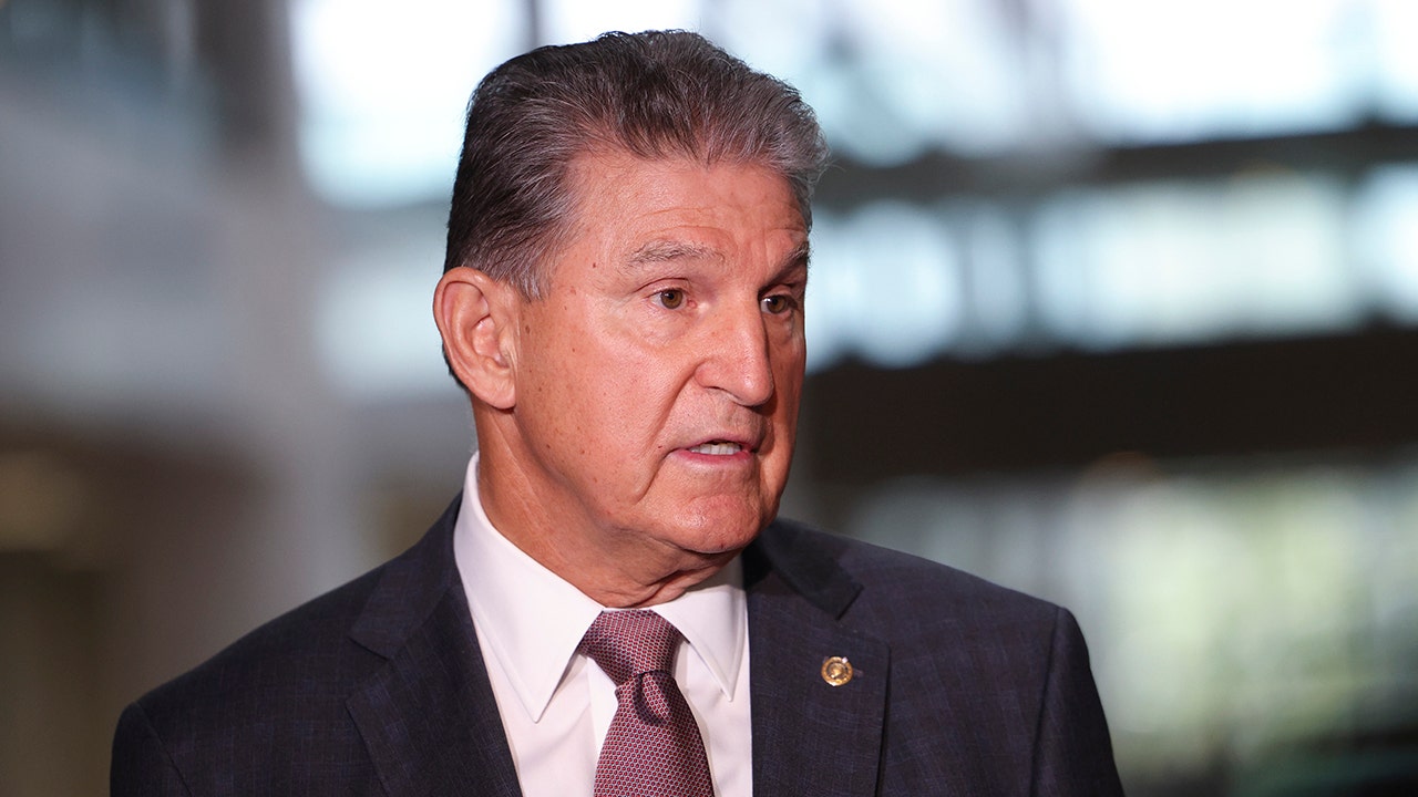 Joe Manchin blockaded in his car by climate protesters who claim he tried to run them over