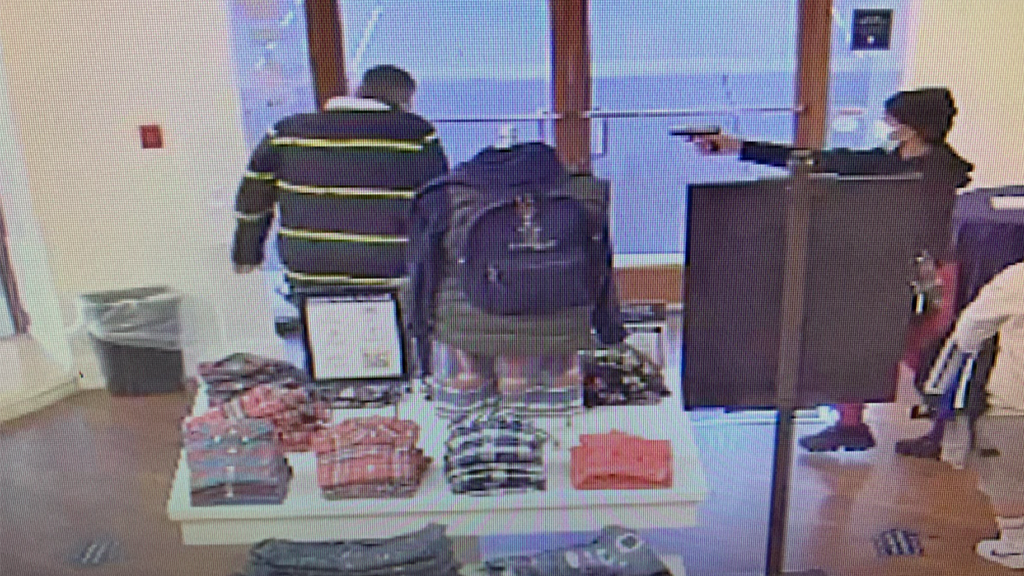 Oregon Polo Ralph Lauren store gunman caught on camera pointing gun at employee