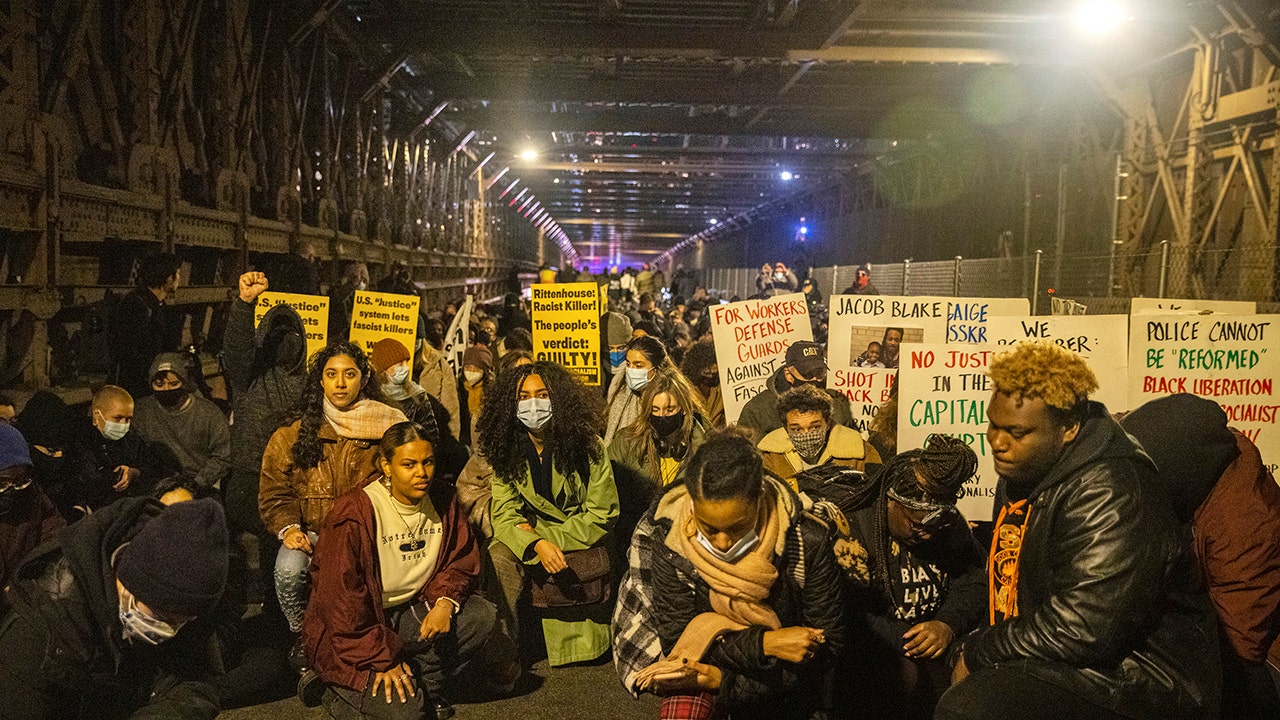 Brooklyn Bridge protesters kneel for those shot by Kyle Rittenhouse after acquittal