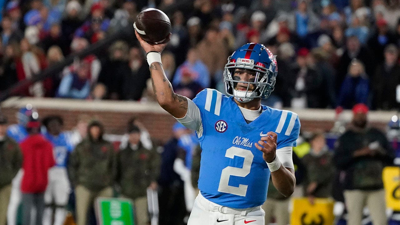 Matt Corral of the Mississippi Rebels looks to pass against the  Ole  miss football, College football uniforms, Ole miss rebels football