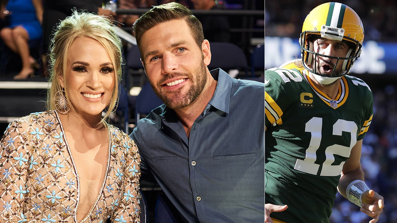 Carrie Underwood's husband, Mike Fisher, says he supports Aaron Rodgers