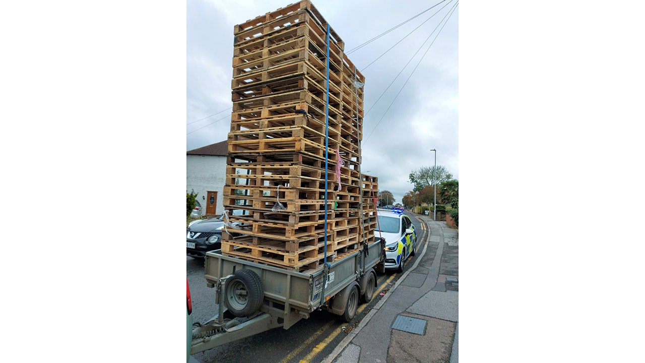 Jenga bus? Car towing 20-foot tall stack of pallets pulled over by police