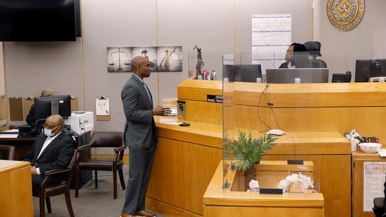 Defense attorney Kobby Warren, center, asks Judge Raquel "Rocky" Jones, right, about the motions and language being sent to the jury after one juror is hanging up the deliberations in the capital murder trial of Billy Chemirmir, left at the Frank Crowley Courts Building in Dallas, Friday, Nov. 19, 2021. Chemirmir, 48, faces life in prison without parole if convicted of capital murder for smothering Lu Thi Harris, 81, and stealing her jewelry. He is accused of killing at least 18 women in Dallas and Collin counties. (Tom Fox/The Dallas Morning News via AP, Pool)
