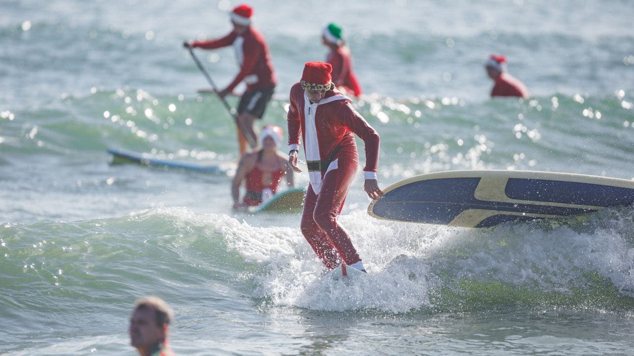 Hundreds of Santas surf on Florida's Space Coast