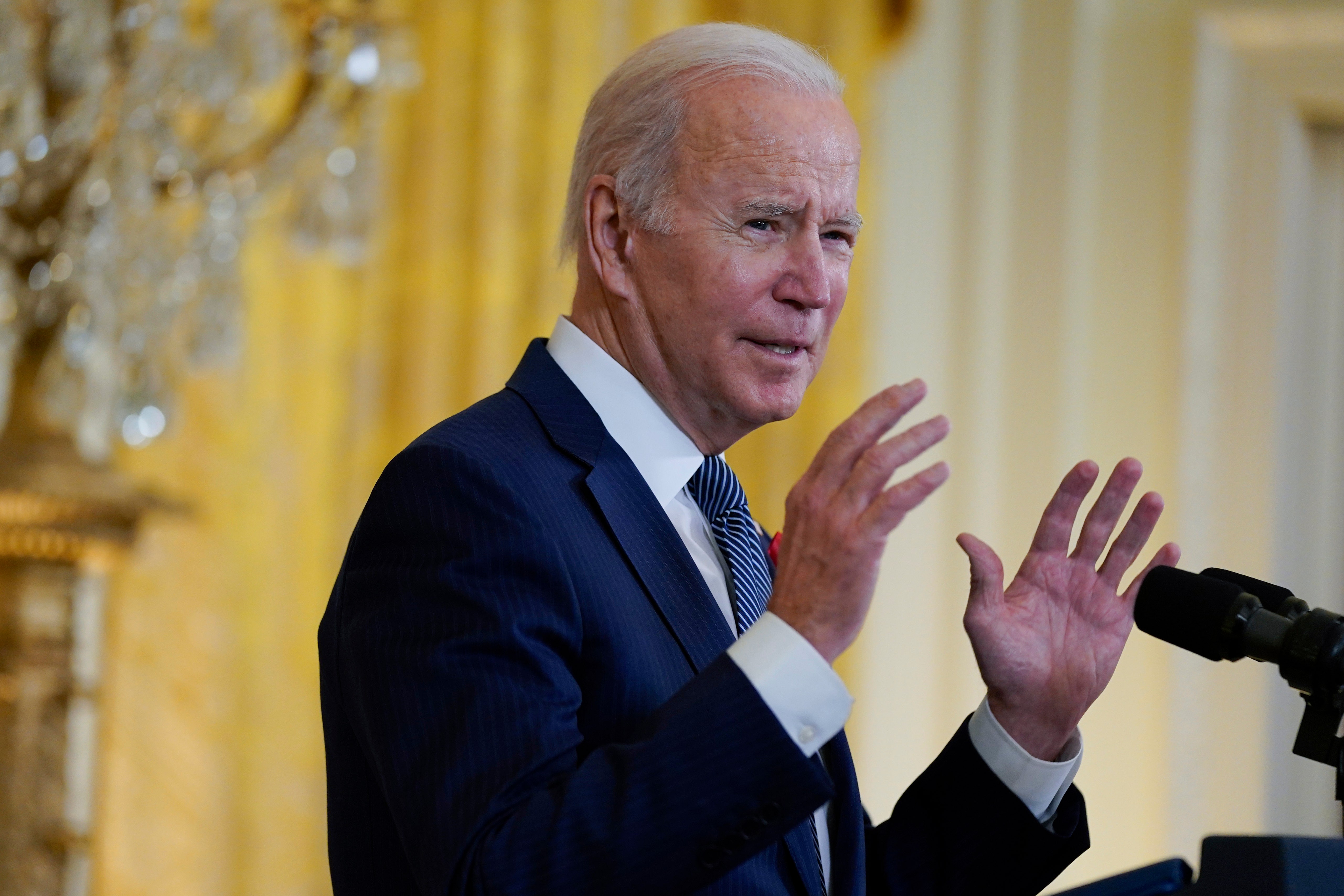 Biden on World AIDS Day declares racism a ‘public health threat’