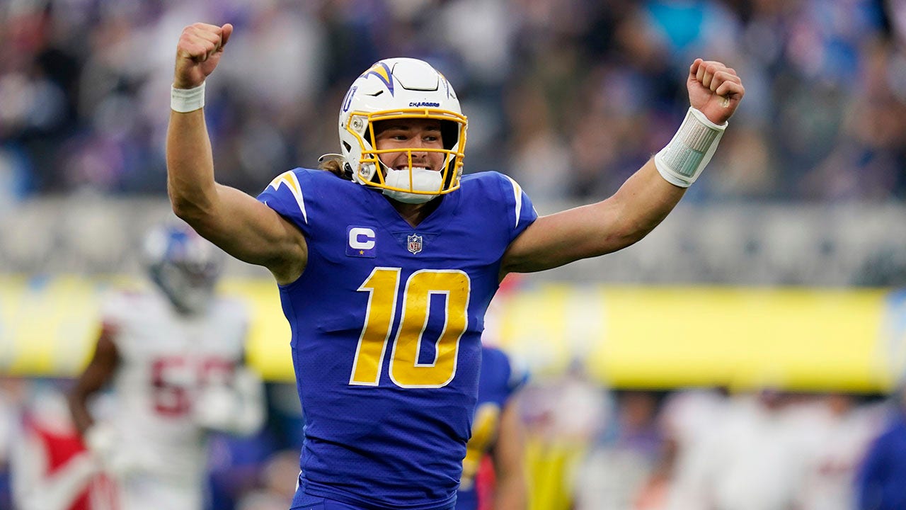 Los Angeles Chargers quarterback Justin Herbert throws a pass during the  first half of an NFL football game against the Kansas City Chiefs,  Thursday, Dec. 16, 2021, in Inglewood, Calif. (AP Photo/Marcio