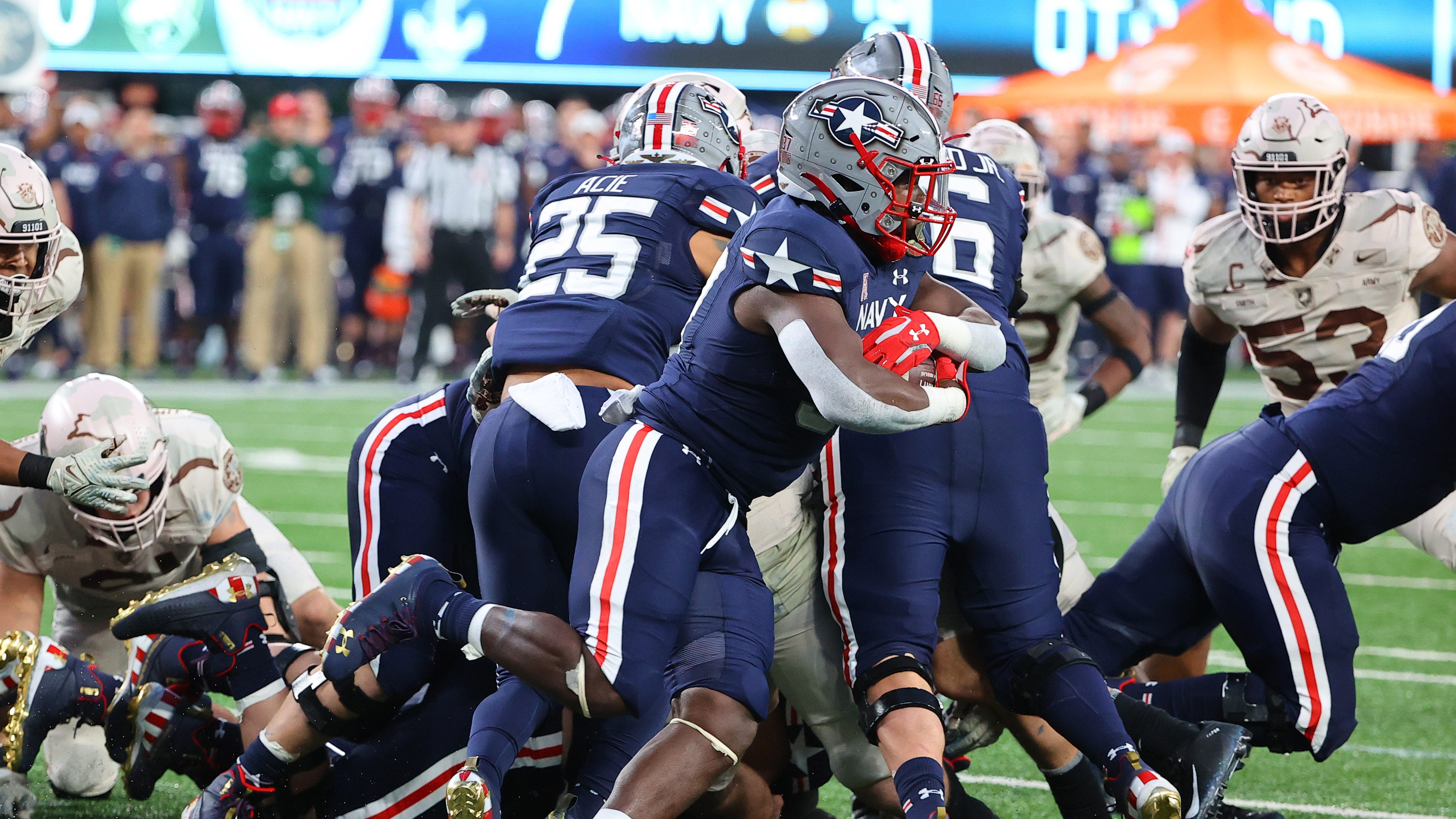Midshipmen celebrate win over Army with son of fallen Navy SEAL