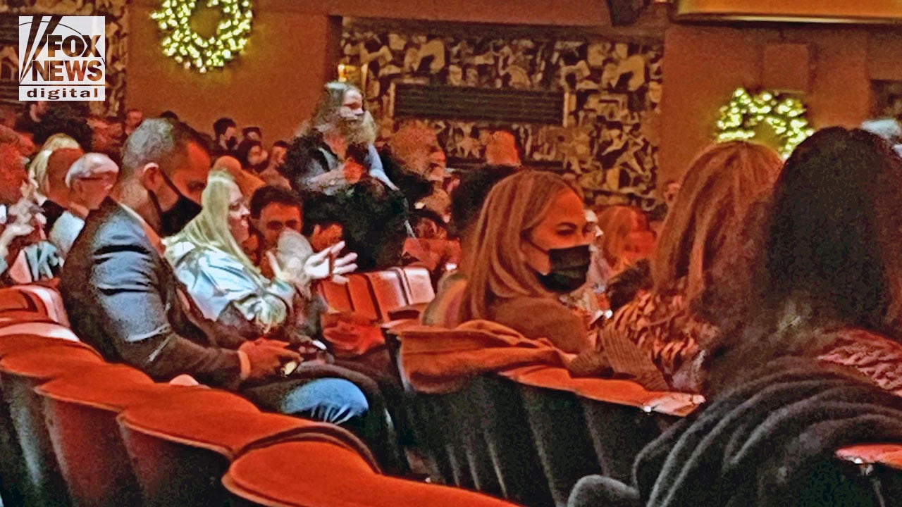 Masked Chrissy Teigen and John Legend buy out entire row at NYC's vax only Radio City Music Hall