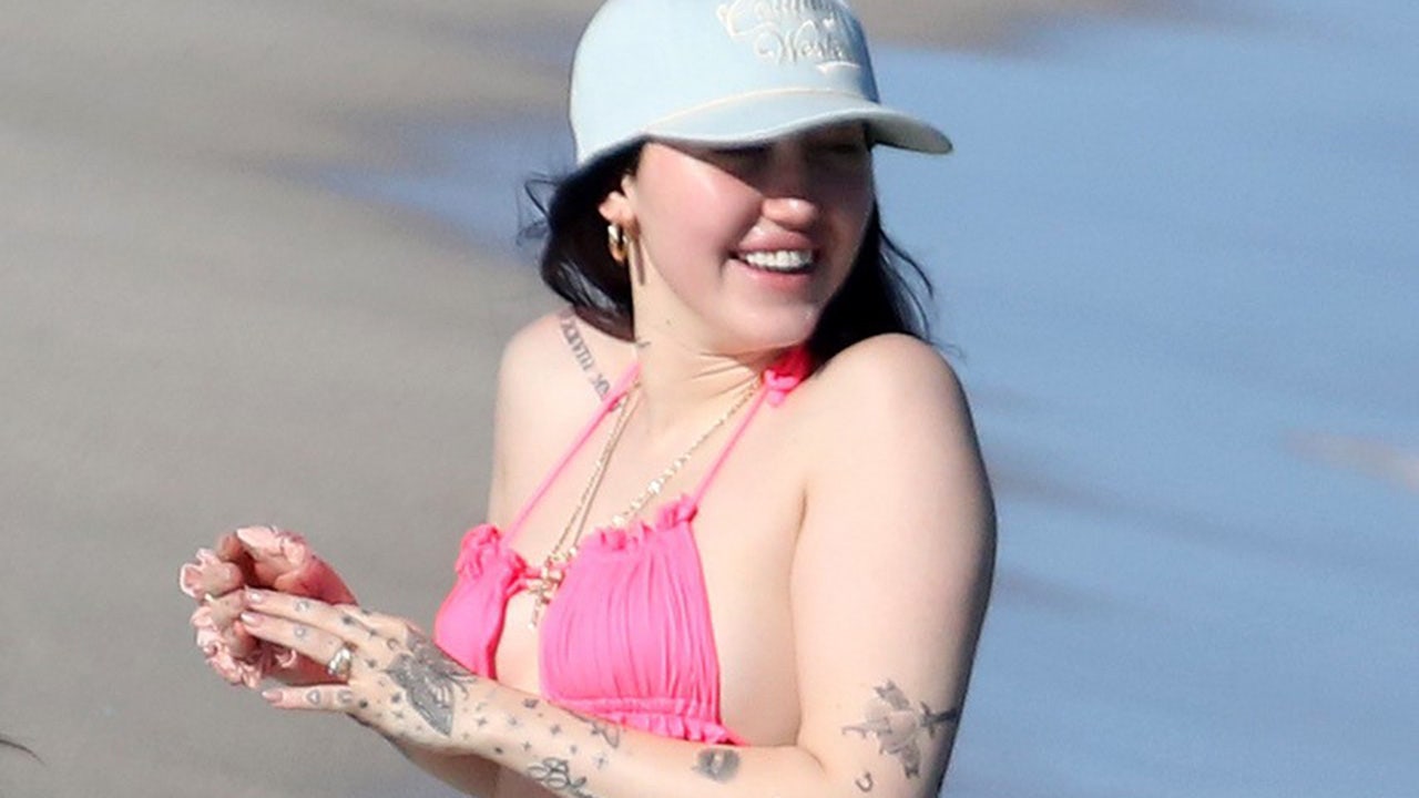 Noah Cyrus hits the beach in hot pink bikini ahead of sister Miley's New Year's Eve gig in Miami