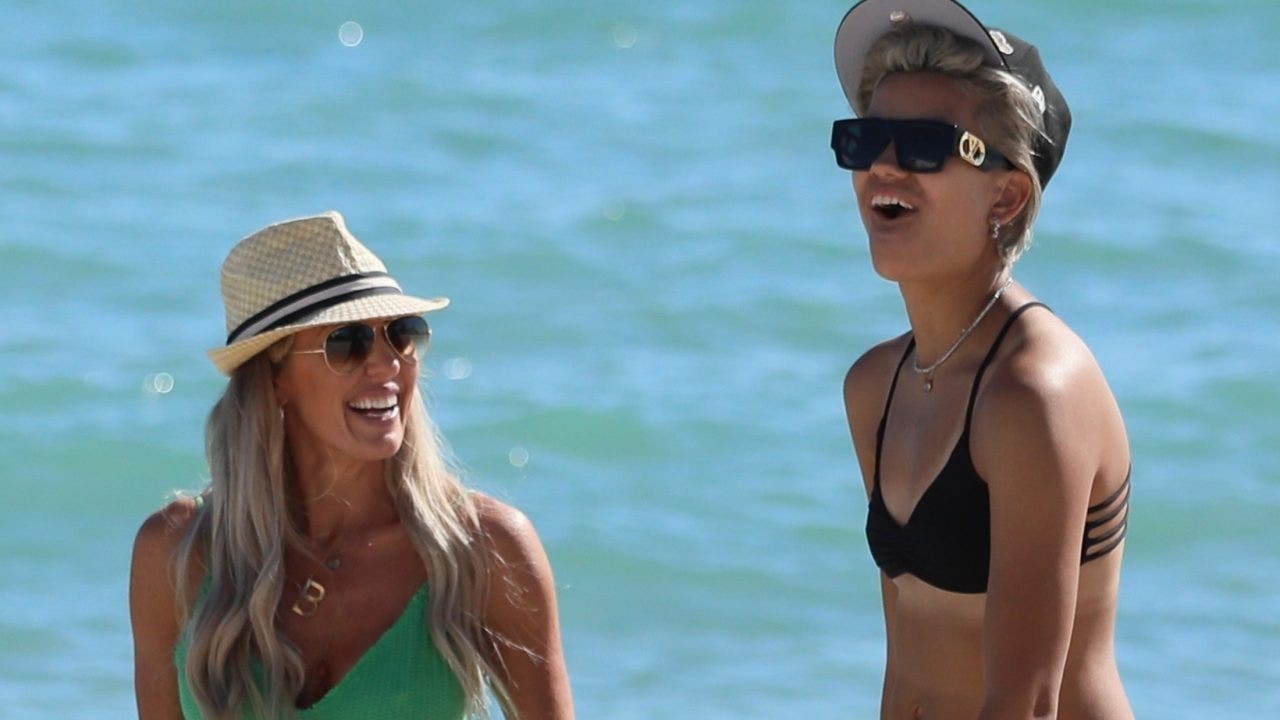 'Real Housewives' star Braunwyn Windham-Burke packs on PDA with new girlfriend during beach day in Miami