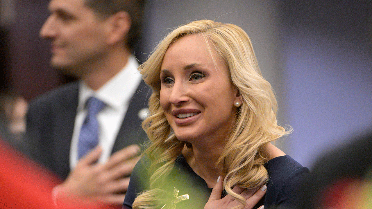 Florida Sen. Lauren Book stands for the Pledge of Allegiance during a legislative session, Tuesday, Jan. 11, 2022, in Tallahassee, Florida.