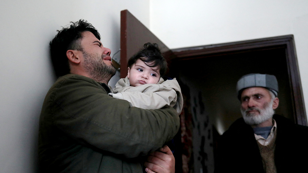 Afghan baby handed to US troops during evacuation chaos returned to family