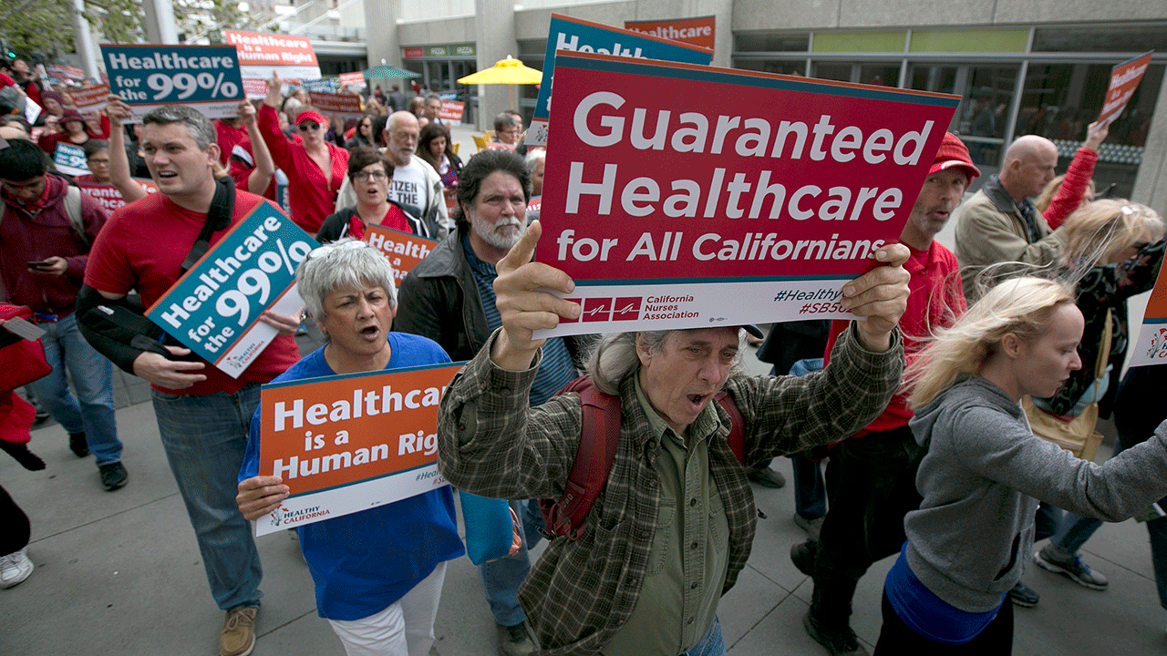 Supporters of single-payer health care march to the Capitol, Wednesday, April 26, 2017, in Sacramento, California. On Monday, Jan. 31, 2022, California Democrats face a deadline to advance a bill that would create a government-funded universal health care system. The proposal has the support of some Democratic leaders and powerful labor union, but it faces strong opposition from business groups who say it would cost too much. (AP Photo/Rich Pedroncelli, File)
