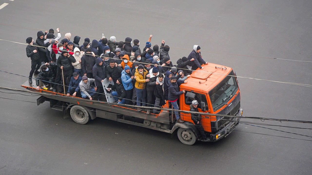 Demonstrators ride a truck during a protest in Almaty, Kazakhstan, Wednesday, Jan. 5, 2022. 