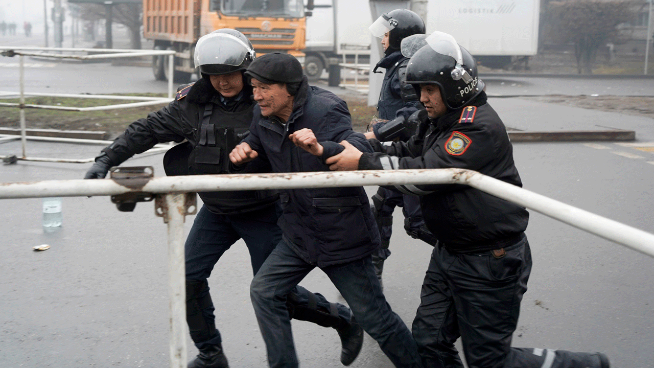 Police officers detain a demonstrator during a protest in Almaty, Kazakhstan, Wednesday, Jan. 5, 2022. 