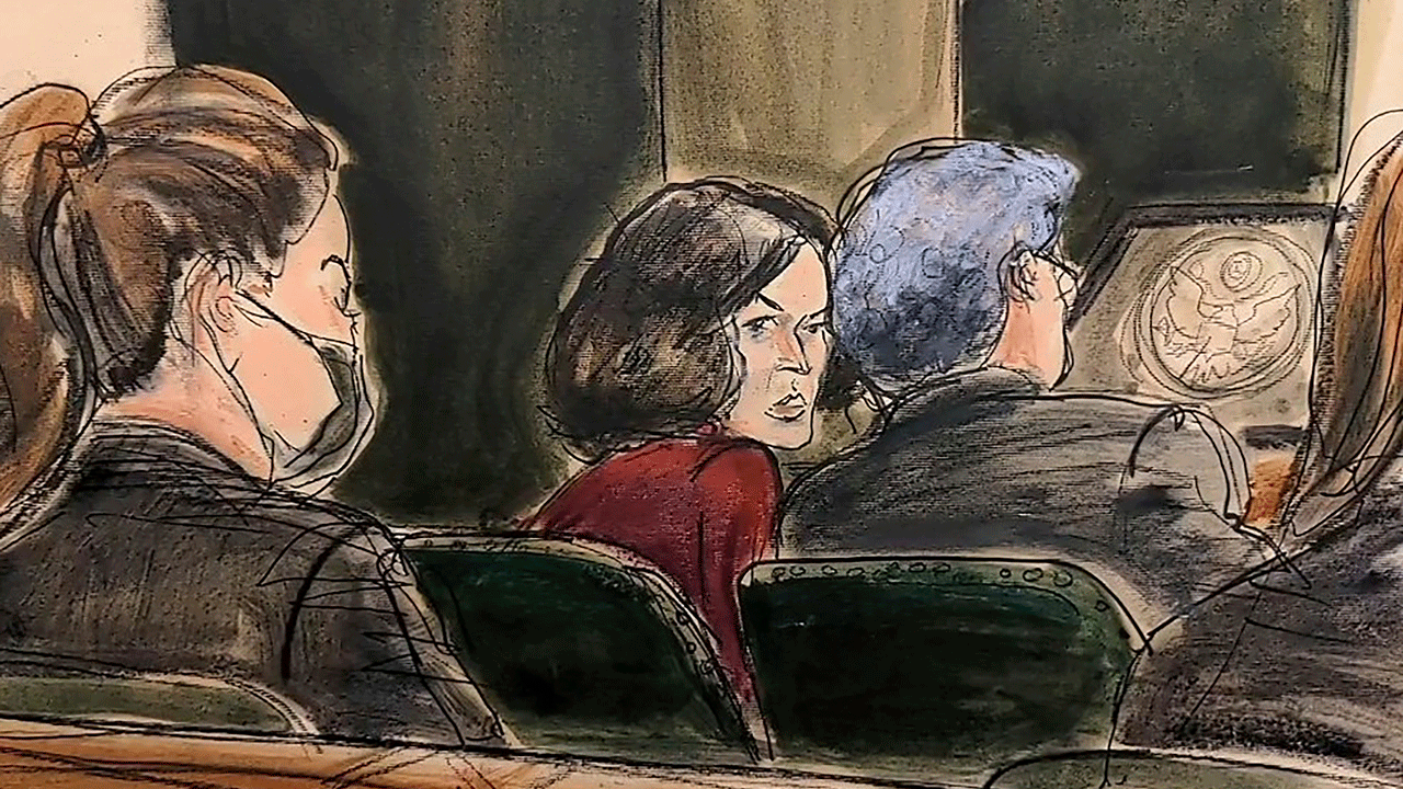 In this courtroom sketch, FBI analyst Kimberly Meder testifies during Ghislaine Maxwell's sex-abuse trial about a photo, shown on video, showing Maxwell, left, massaging Jeffery Epstein's foot at his home, Tuesday, Dec. 7, 2021, in New York. 