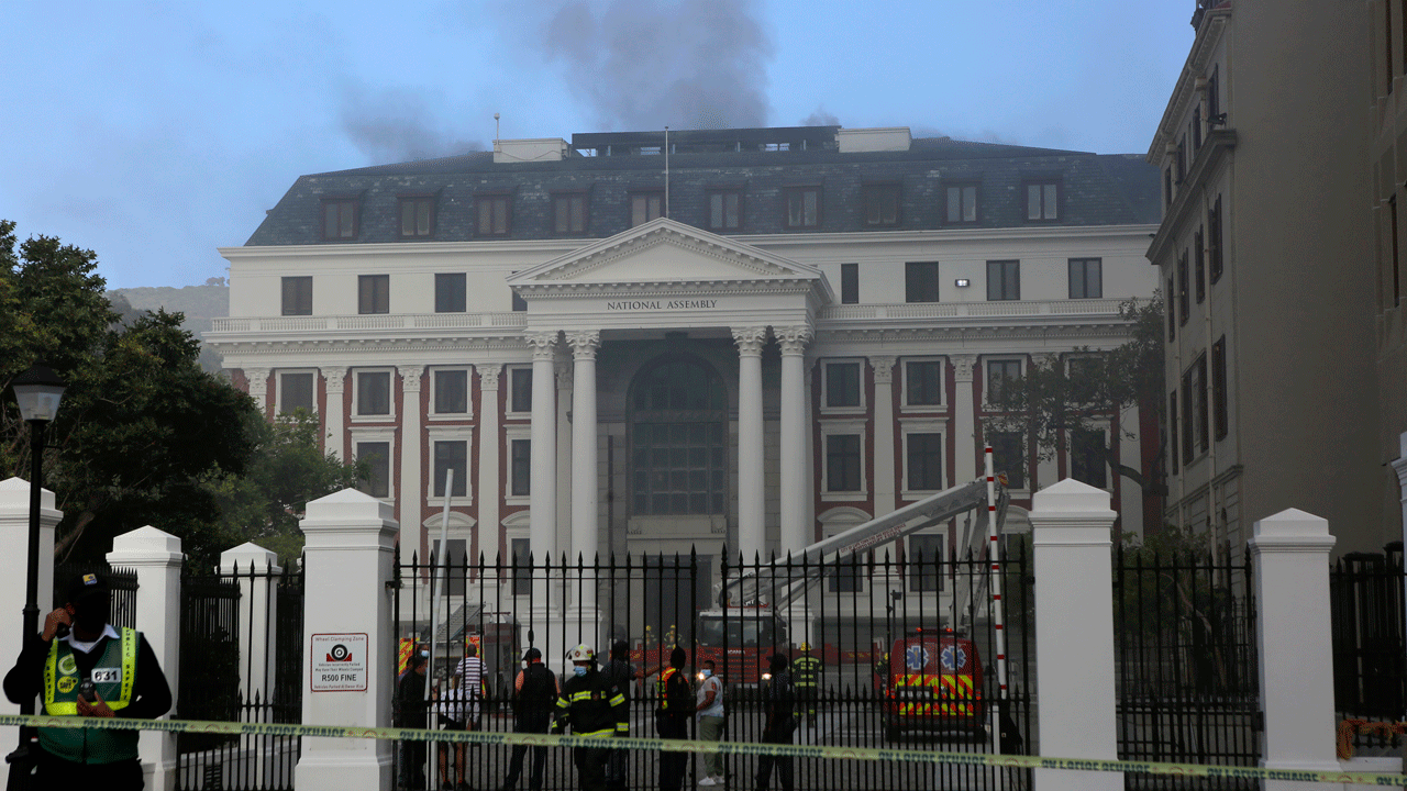 Fire crews at the Houses of Parliament, fight a fire in Cape Town, South Africa, Sunday, Jan. 2, 2022. Firefighters have been deployed and the cause is unknown. (AP Photo/Tsvangirayi Mukwazhi)