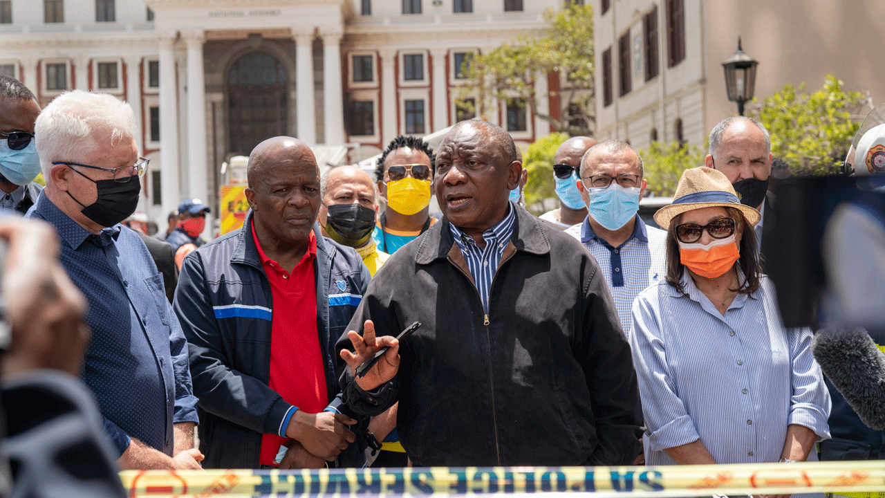 South African President Cyril Ramaphosa briefs reporters after visiting South Africa's Parliament following a large fire in Cape Town Sunday Jan. 2, 2022. (AP Photo/Jerome Delay)