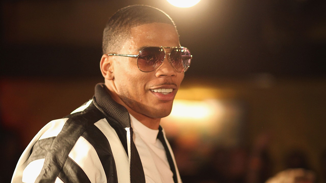 Nelly surprises fan with Lesch-Nyhan syndrome by giving him jacket off his back