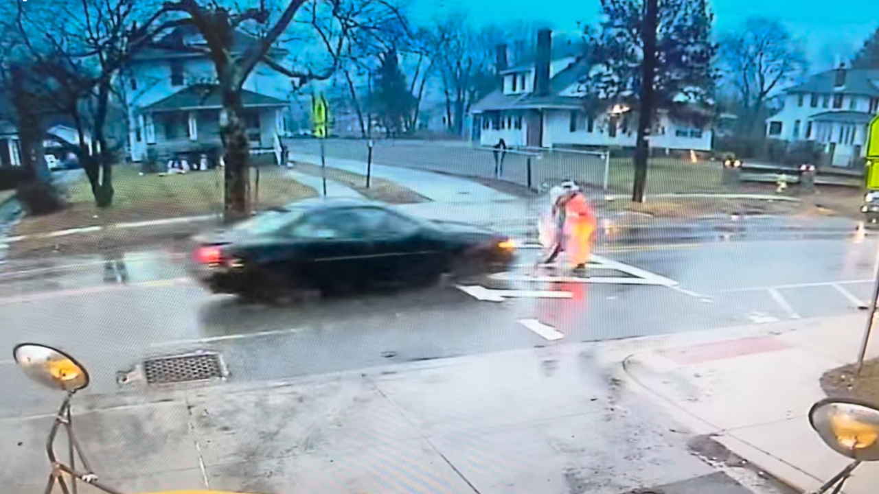 Maryland police officer saves student from oncoming car, video shows