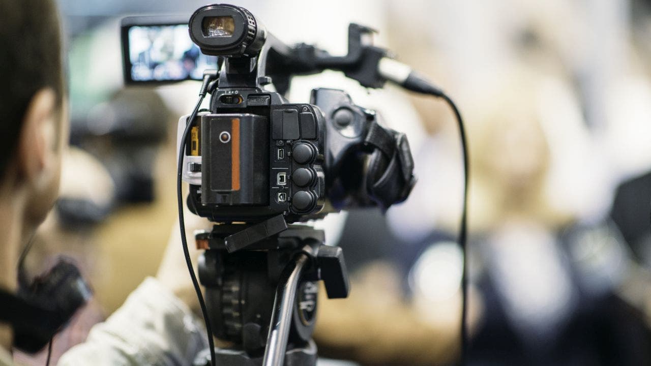 Reporter's mother interrupts news coverage to show her love while he's on-camera: 'Hi baby!'