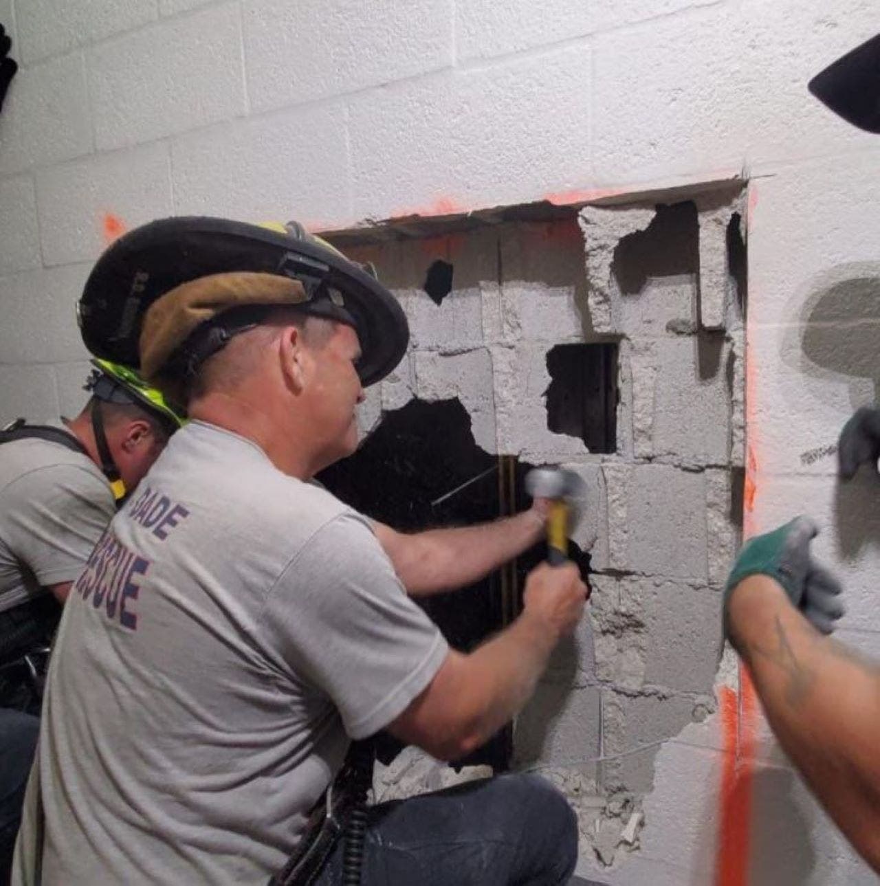 Florida fire rescue crews break through wall to rescue pair trapped in elevator on 37th floor