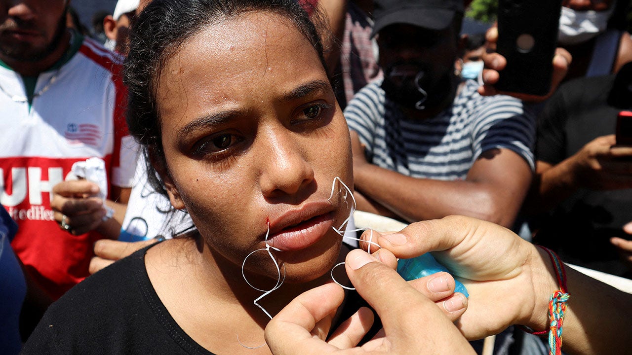 Migrants on Mexico’s southern border sew mouths shut as they demand passage to US