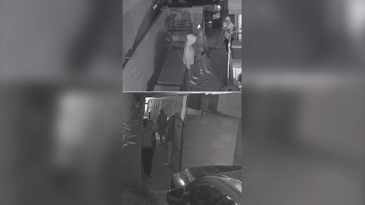 Terrifying moments were caught on security camera after several people armed with guns reportedly burglarized a Phoenix, Ariz. home.