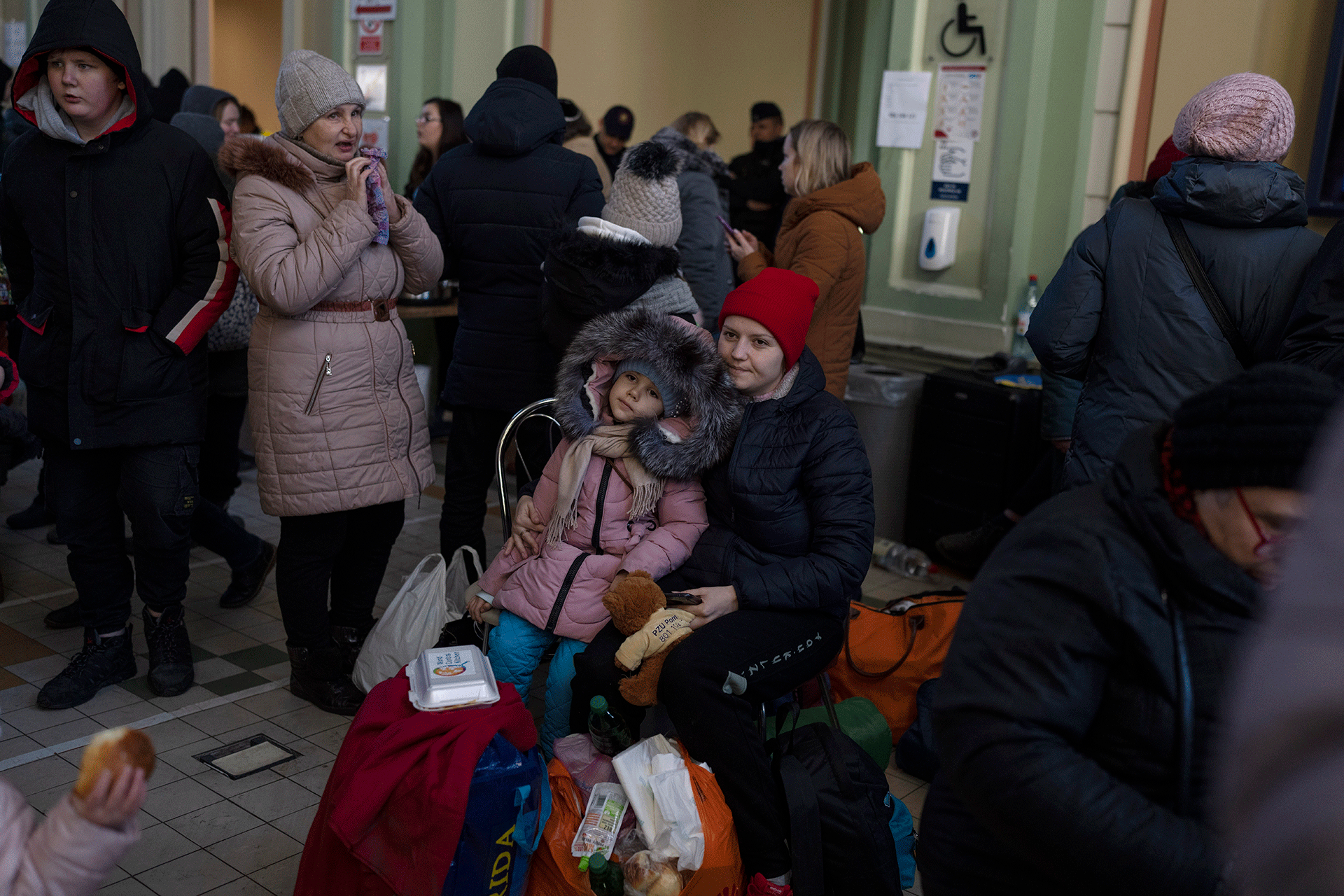 Ukrainian refugees wait at Przemysl train station.