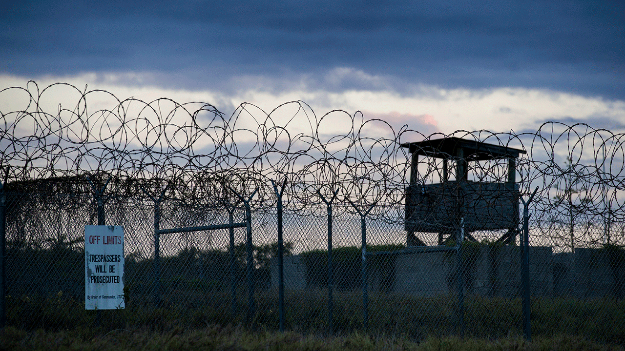 In this photo reviewed by U.S. military officials, the sun sets behind the closed Camp X-Ray detention facility, on April 17, 2019, in Guantanamo Bay Naval Base, Cuba.