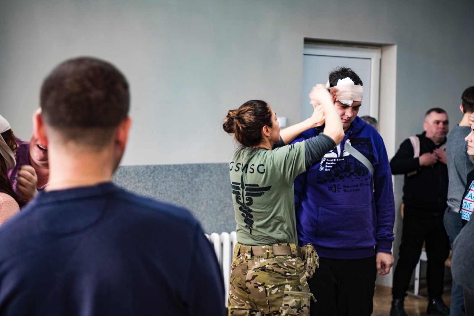 US special ops veterans, medical professionals training Ukrainian soldiers, civilians in combat care