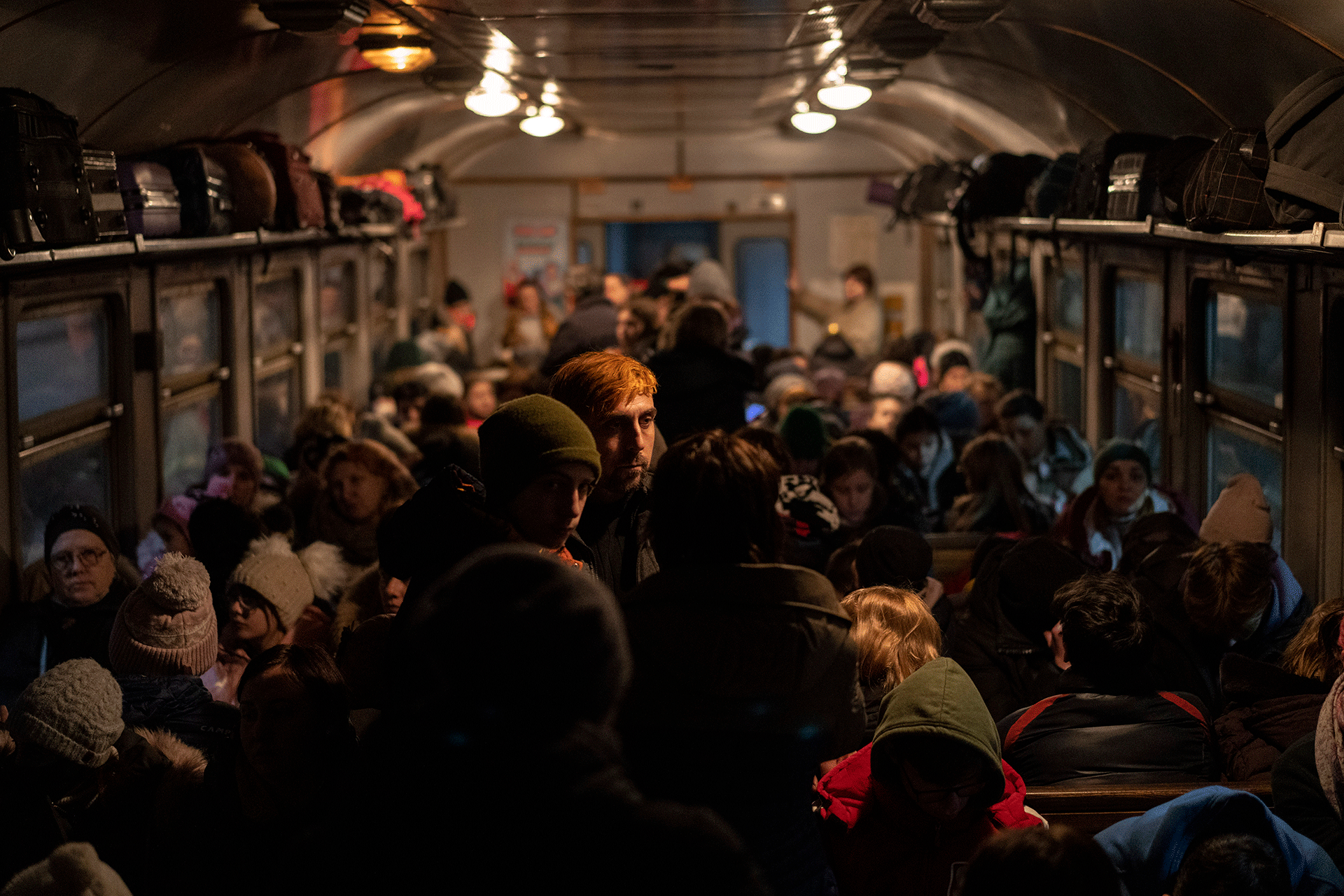 Displaced Ukrainians onboard a Poland-bound train in Lviv, western Ukraine, Sunday, March 13, 2022. 