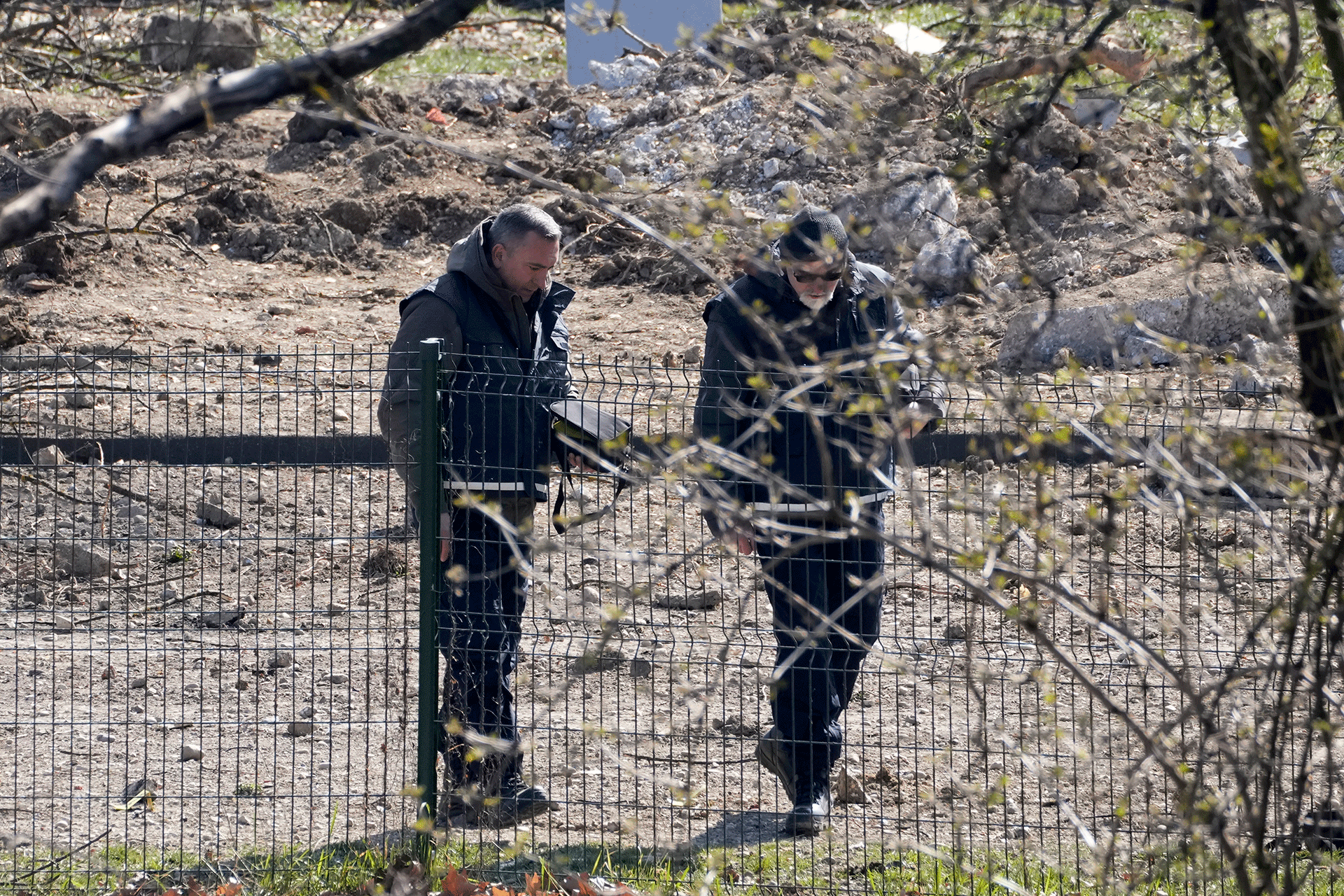Police inspect the site of a drone crash in Zagreb, Croatia, Friday, March 11, 2022. A drone that apparently flew from the Ukrainian war zone crashed overnight on the outskirts of the Croatian capital, Zagreb, triggering a loud blast but causing no injuries, Croatian authorities said Friday. 
