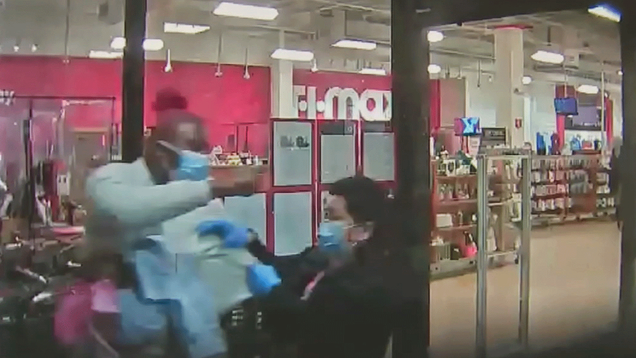 A robbery suspect is seen on camera pepper spraying a TJ Maxx employee in Newton, Mass. 