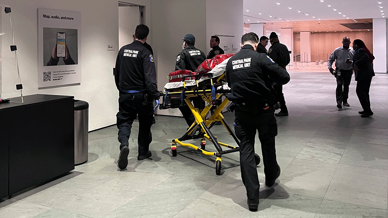 this photo provided by Yuichi Shimada, medical personnel respond at the Museum of Modern Art in New York after a man stabbed two employees after he was denied entrance for previous incidents of disorderly conduct, Saturday, March 12, 2022. (Yuichi Shimada via AP)
