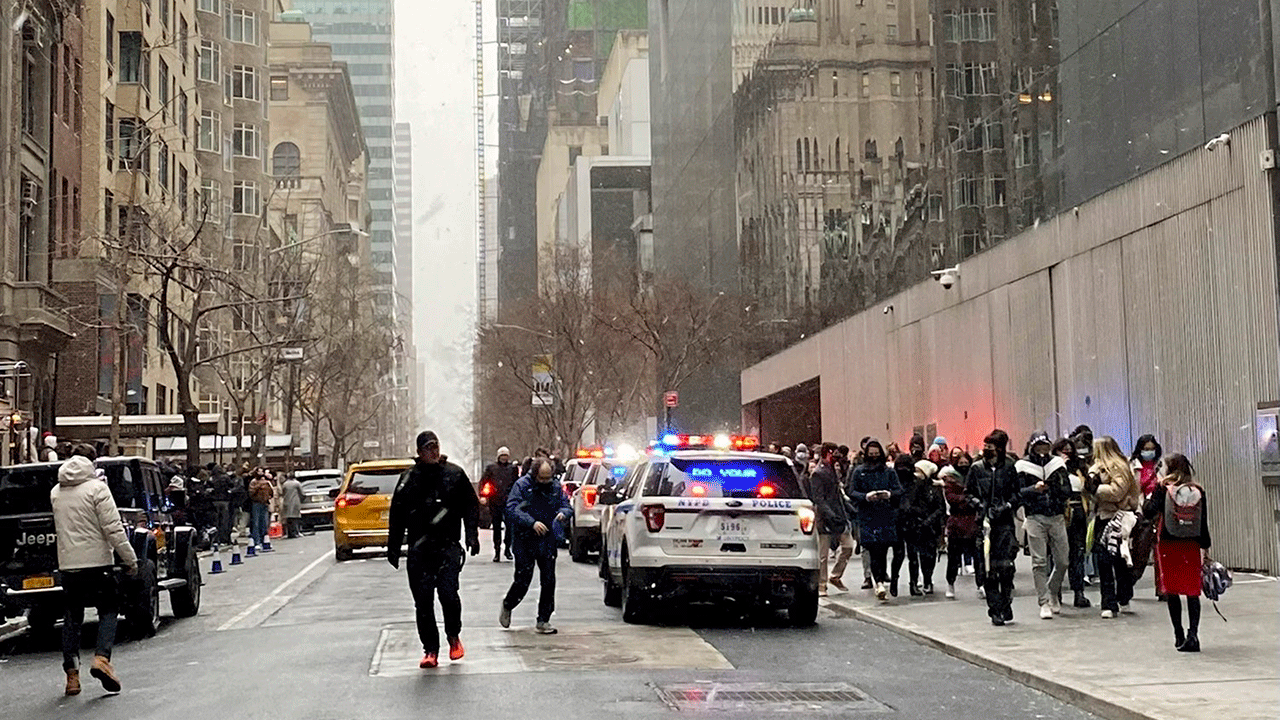 In this photo from a social media post by Scott Cowdrey, people are evacuated from the Museum of Modern Art where a stabbing occurred, Saturday, March 12, 2022, in New York. Police said two people were stabbed inside MoMA and in stable condition at Bellevue Hospital. (Scott Cowdrey via AP)