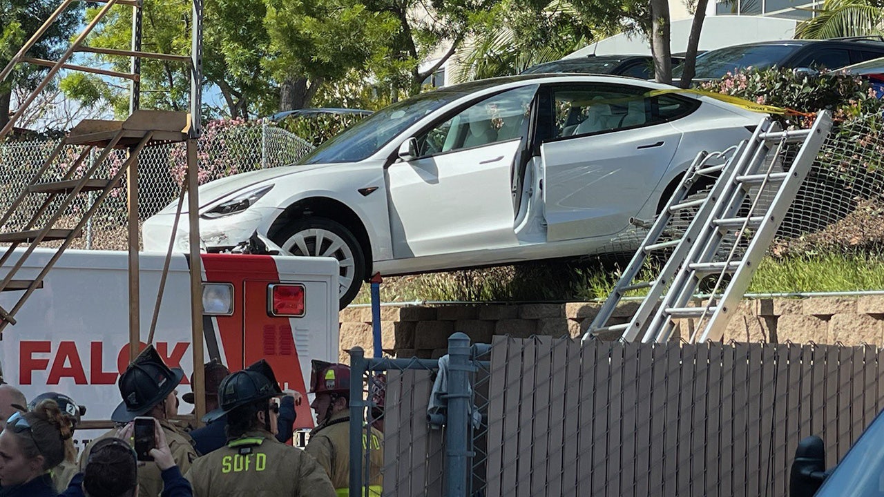 San Diego Tesla driver crashes on top of ambulance