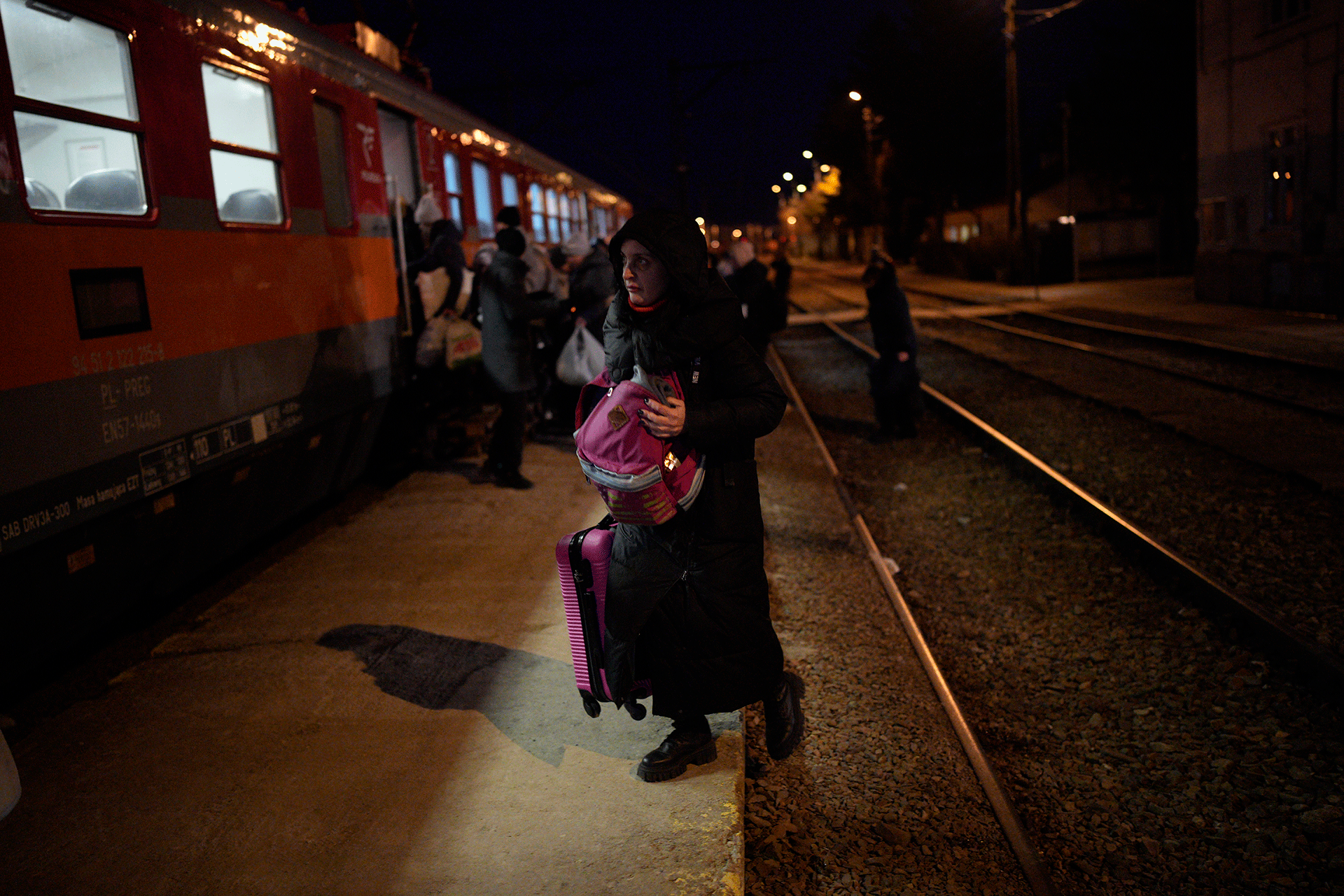 Refugees fleeing war in neighboring Ukraine board a train at the Medyka border crossing on Thursday.