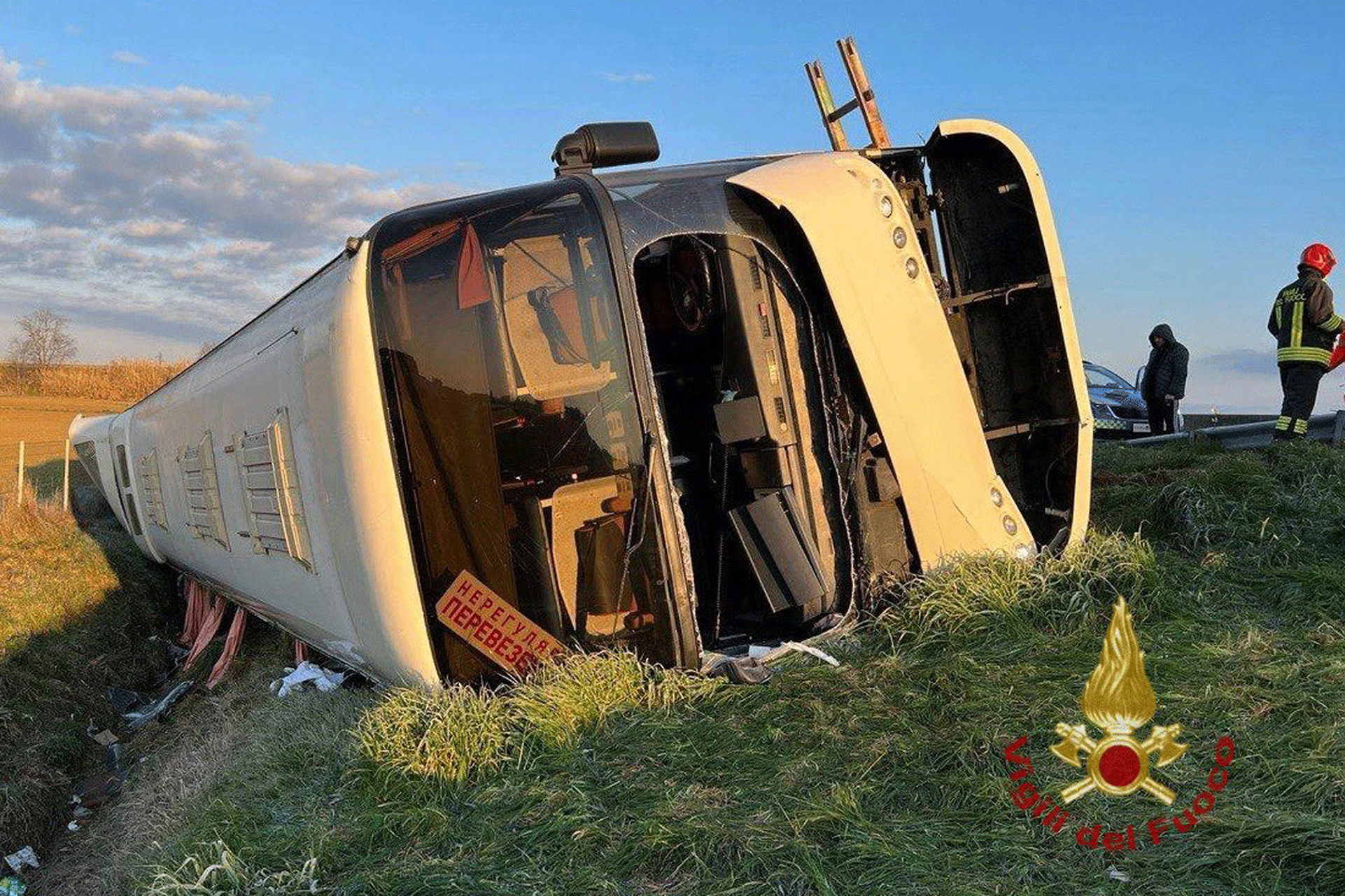 A bus lies on its side after overturning near Forli, Italy, Sunday, March 13, 2022.