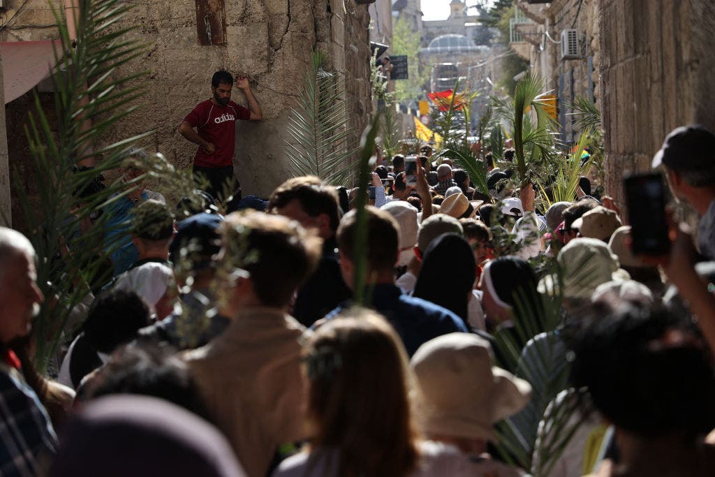 Palm Sunday sees thousands of Christians mark the triumphal entry in Jerusalem amid tensions