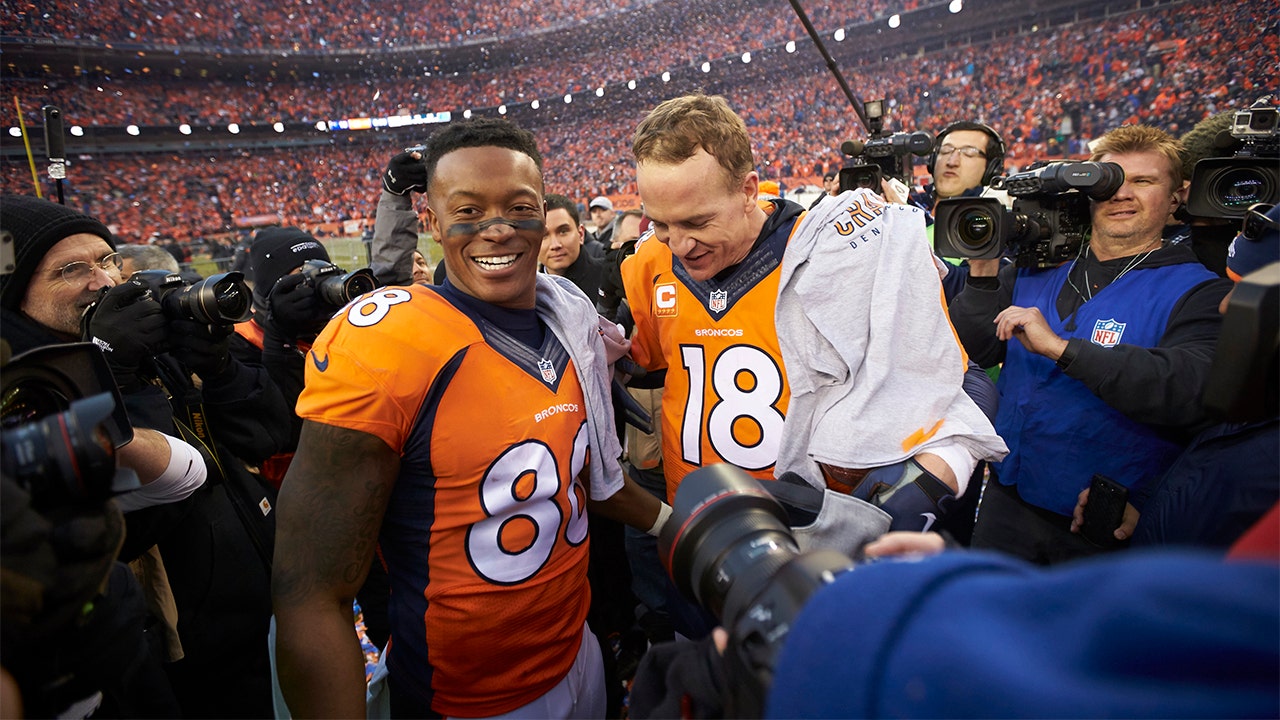 Peyton Manning of the Denver Broncos runs on the field in the first News  Photo - Getty Images