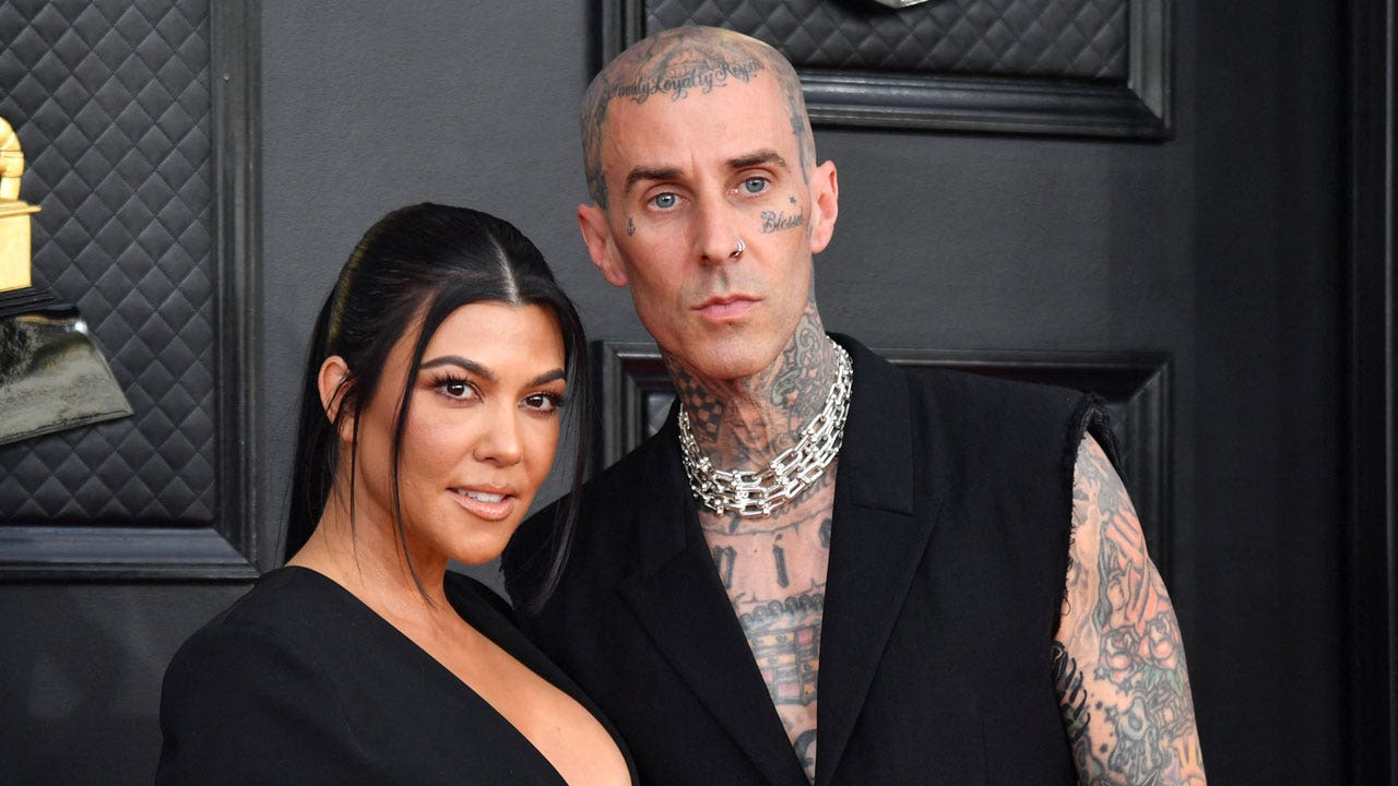 Kourtney Kardashian and Travis Barker. (Getty Images)